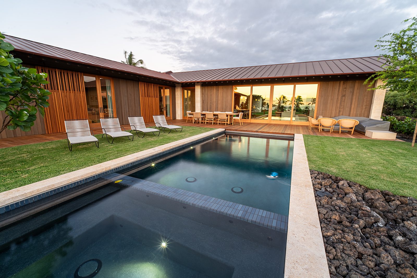 Pool terrace and residence at dusk